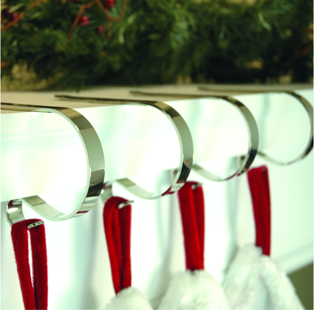 Shiny silver Christmas stocking hangers for mantels by Haute Decor.